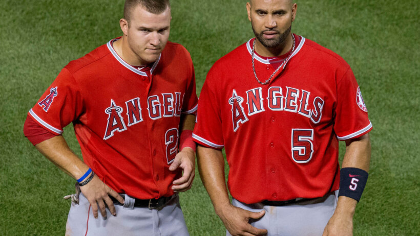 Mike Trout and Albert Pujols of the LA Angels on the field.