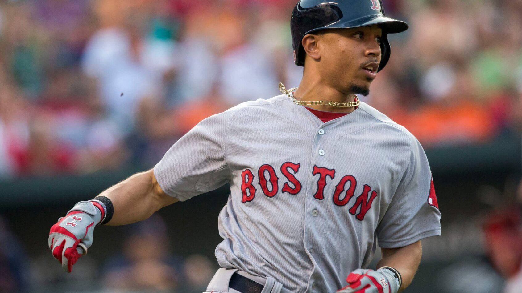 Mookie Betts runs to first base