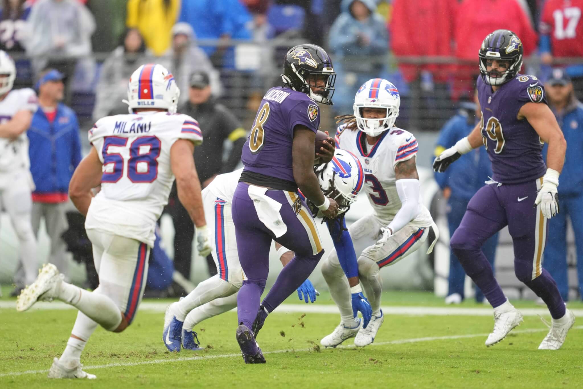 Baltimore Ravens quarterback Lamar Jackson runs the ball against the Buffalo Bills