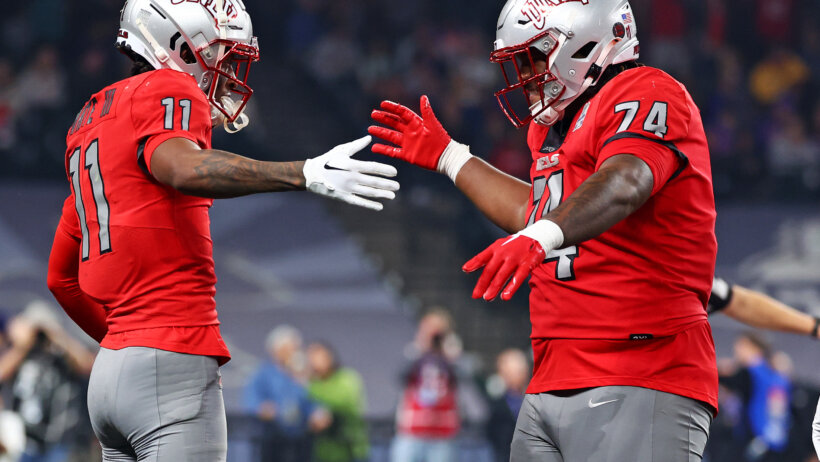 UNLV Rebels wide receiver Ricky White celebrates with offensive lineman Jalen St. John