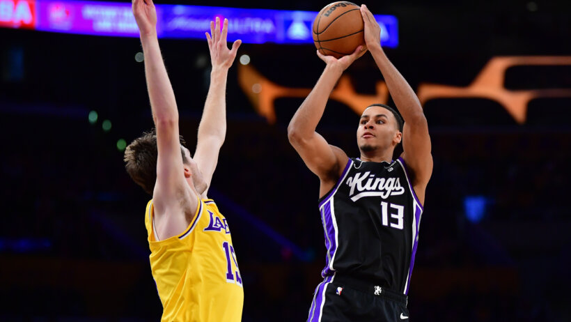 Sacramento Kings forward Keegan Murray shoots against Los Angeles Lakers guard Austin Reaves