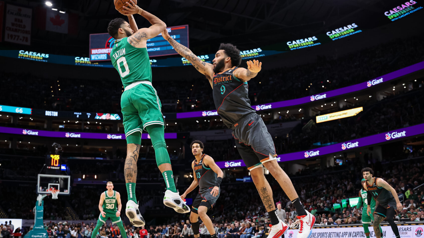 Boston Celtics forward Jayson Tatum shoots over Washington Wizards forward Justin Champagnie