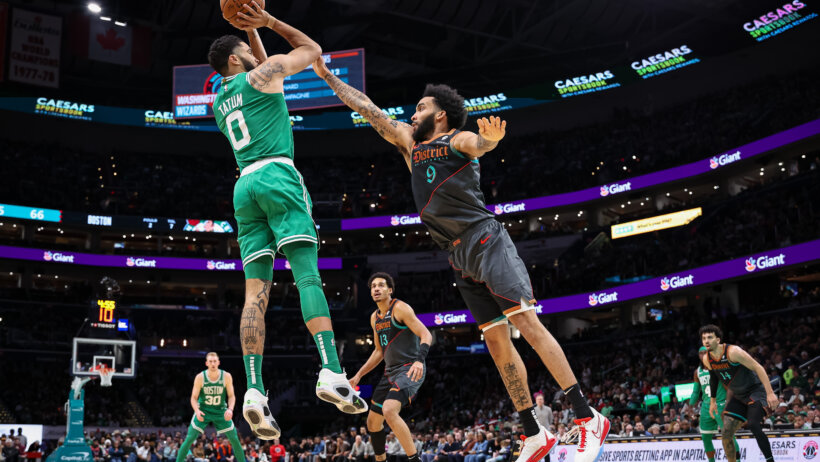 Boston Celtics forward Jayson Tatum shoots over Washington Wizards forward Justin Champagnie