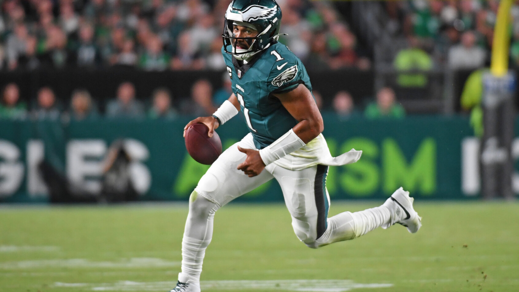 Philadelphia Eagles quarterback Jalen Hurts runs with the football