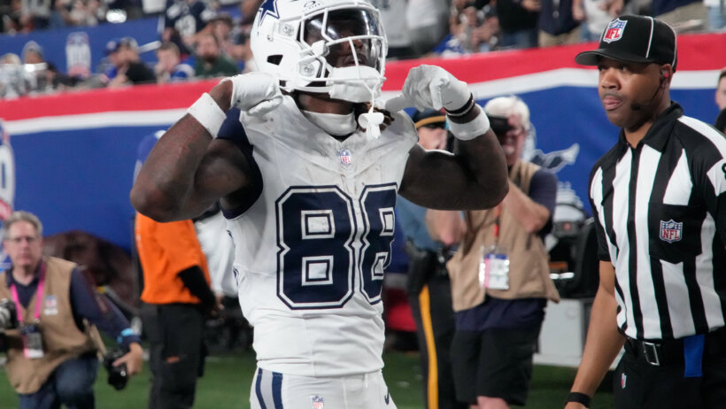 Dallas Cowboys wide receiver CeeDee Lamb flexes after scoring a TD