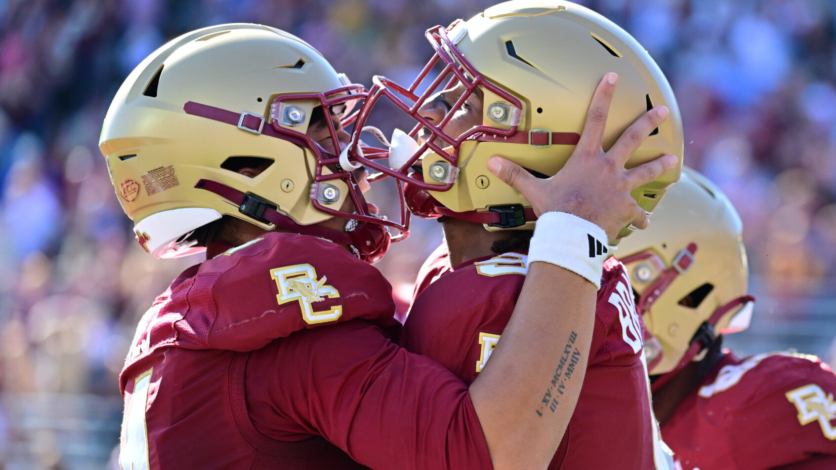 Boston College Eagles quarterback Grayson James celebrates a touchdown with defensive lineman Ty Clemons