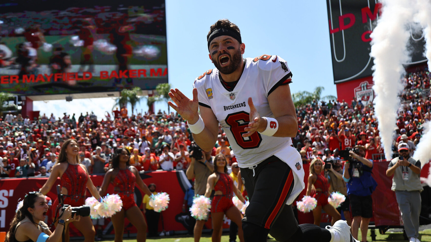 Baker Mayfield runs out of the tunnel.