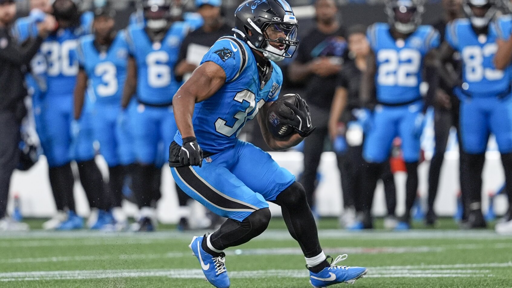 Chuba Hubbard running with the football