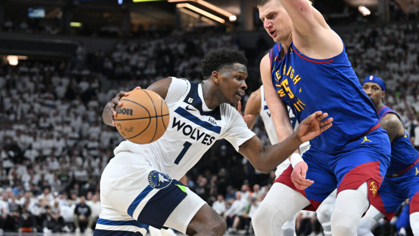 Timberwolves guard Anthony Edwards goes to the basket against Denver Nuggets center Nikola Jokic