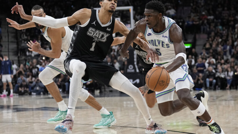 Timberwolves guard Anthony Edwards drives to the basket against San Antonio Spurs forward Victor Wembanyama