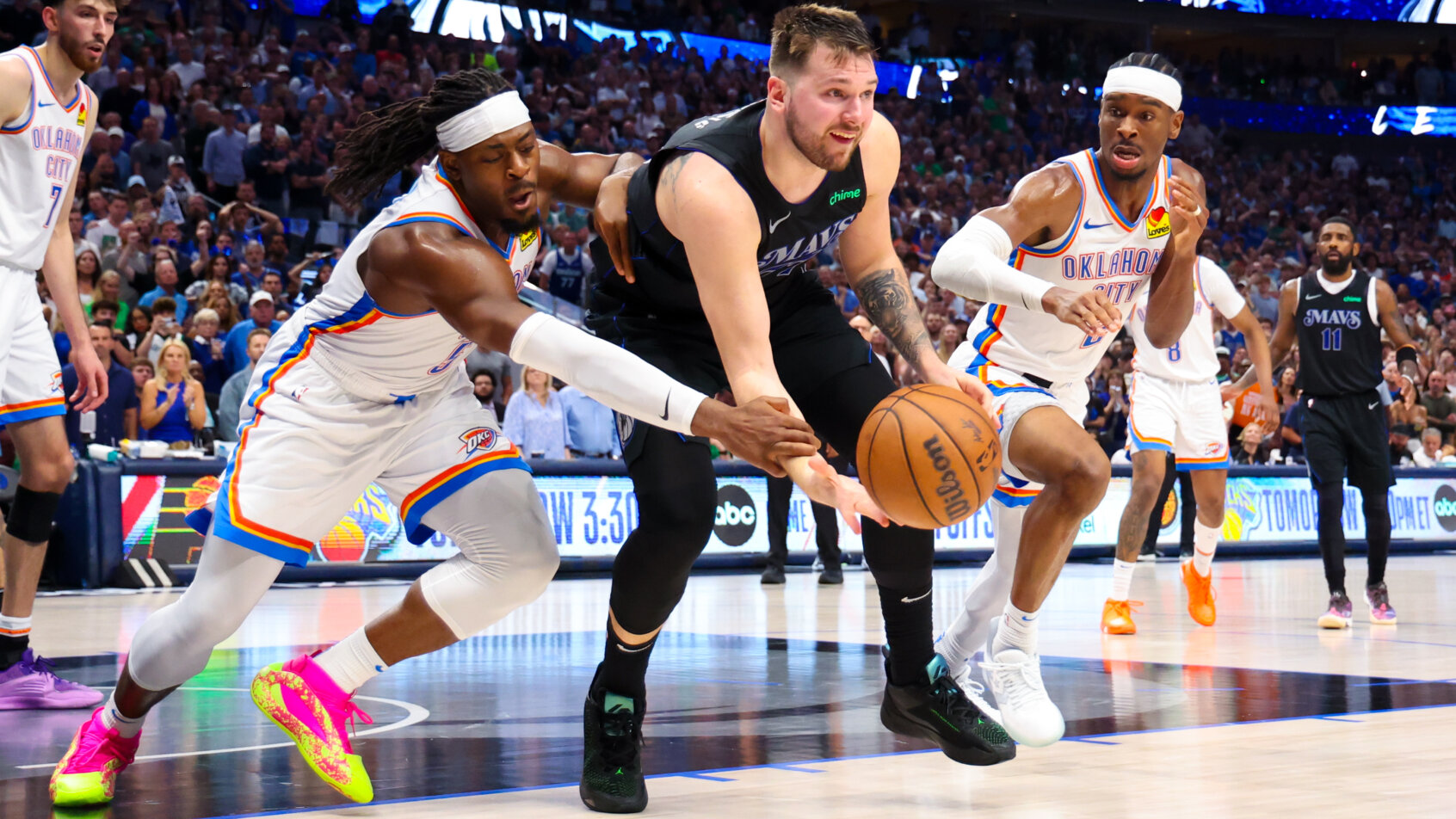 Dallas Mavericks guard Luka Doncic guarded by Oklahoma City Thunder guard Luguentz