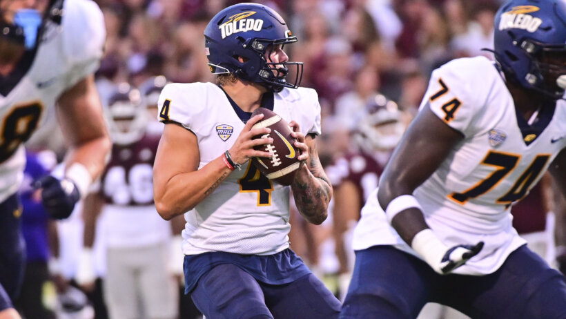 Toledo Rockets quarterback Tucker Gleason looks to pass