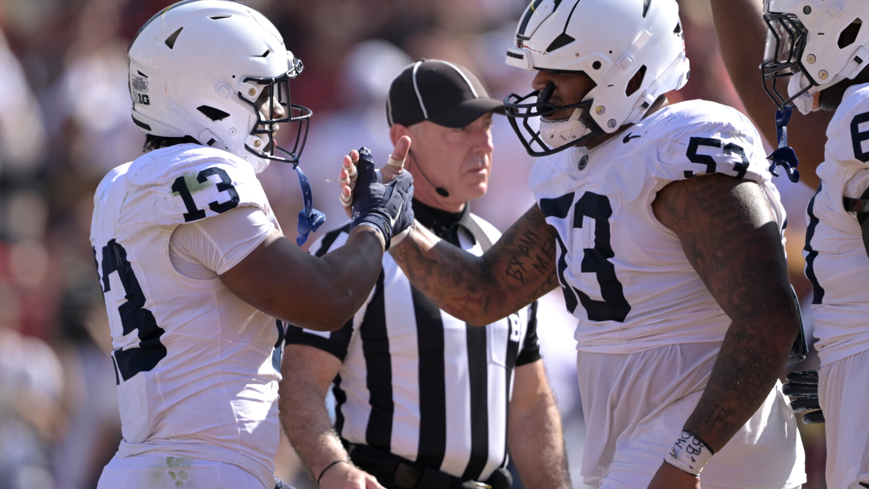 Penn State Nittany Lions running back Kaytron Allen is congratulated by offensive lineman Nick Dawkins
