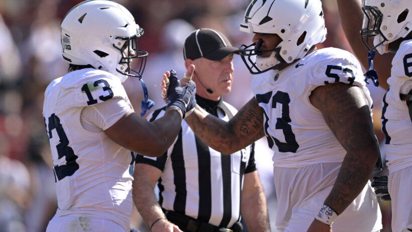 Penn State Nittany Lions running back Kaytron Allen is congratulated by offensive lineman Nick Dawkins
