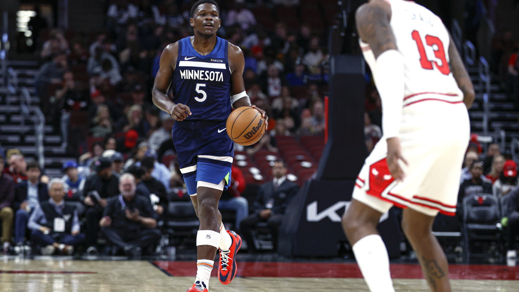Minnesota Timberwolves guard Anthony Edwards dribbling the ball up the court
