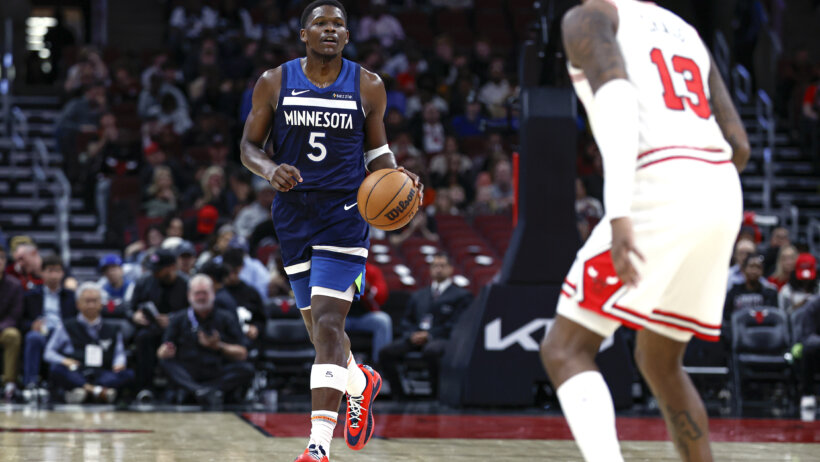 Minnesota Timberwolves guard Anthony Edwards dribbling the ball up the court