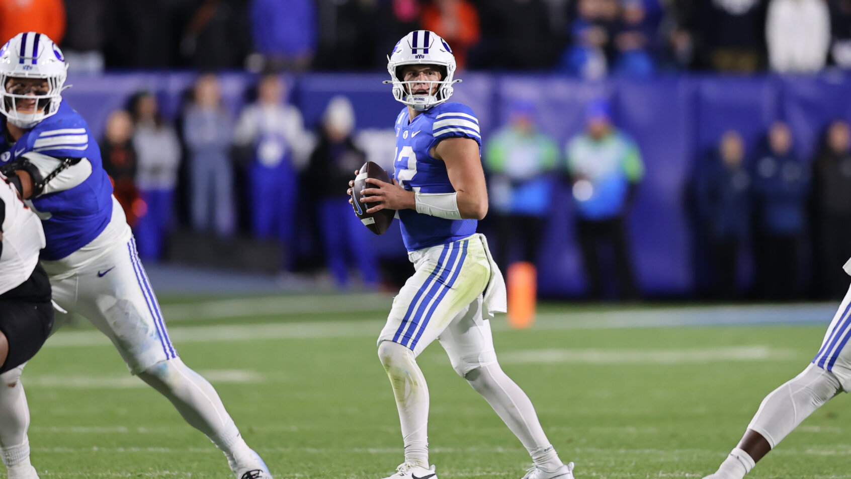 BYU Cougars quarterback Jake Retzlaff drops back to pass