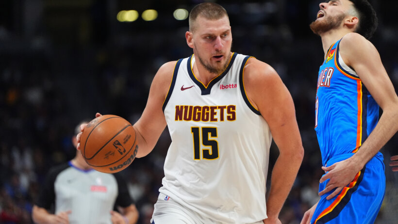 Denver Nuggets center Nikola Jokic drives at Oklahoma City Thunder forward Chet Holmgren