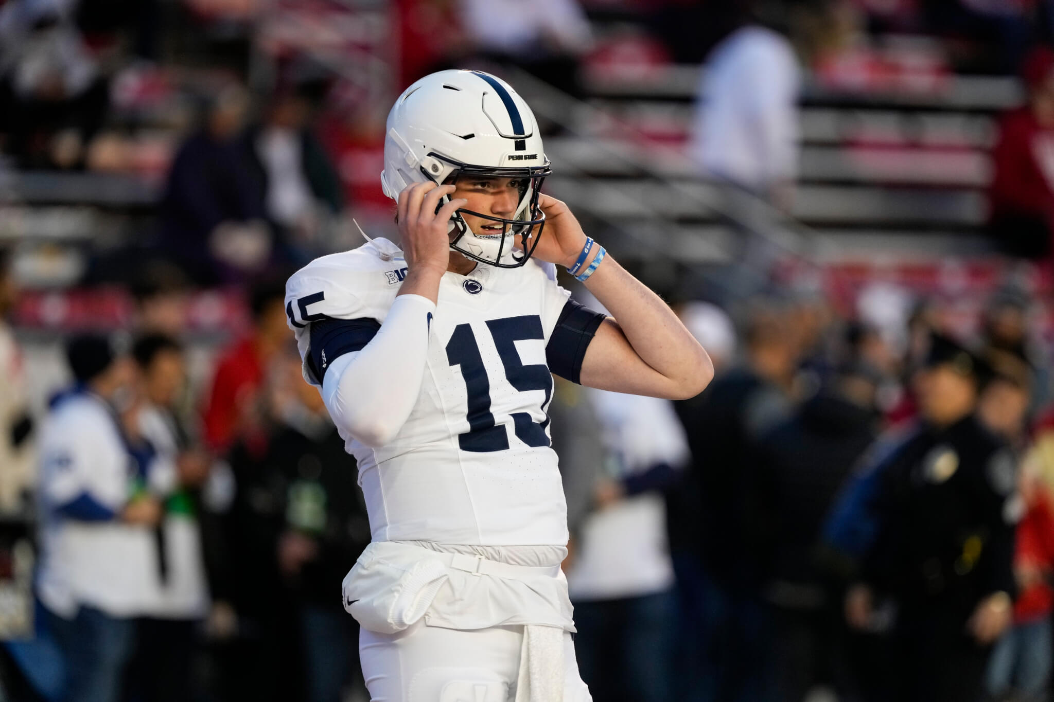 Drew Allar adjusts helmet