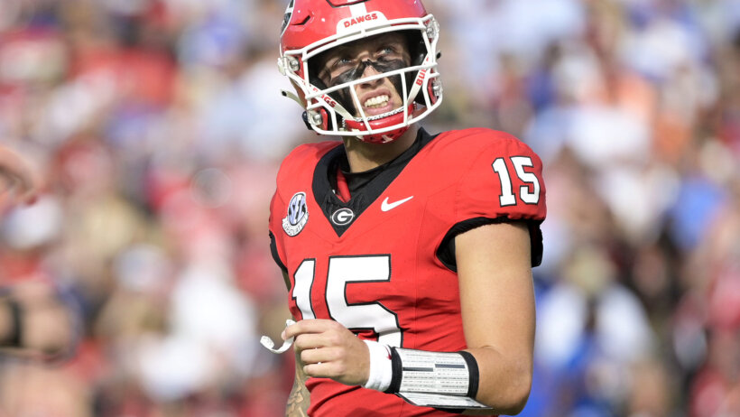 Georgia Bulldogs quarterback Carson Beck reacts after throwing an interception
