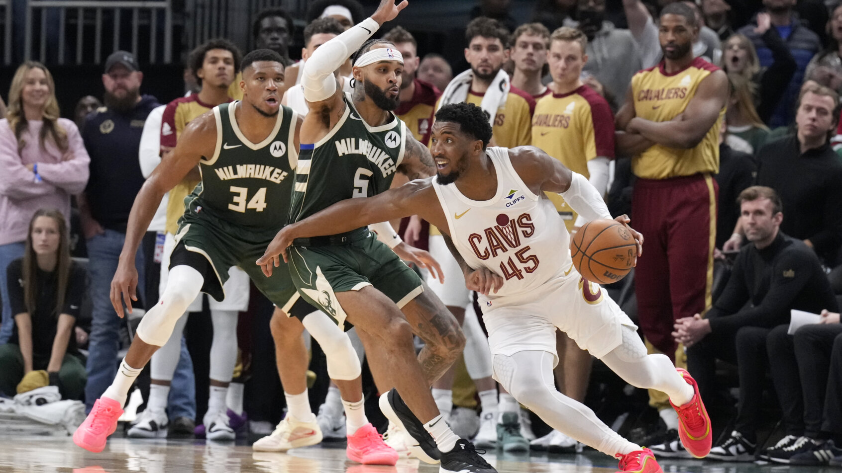 Cleveland Cavaliers guard Donovan Mitchell driving around a defender