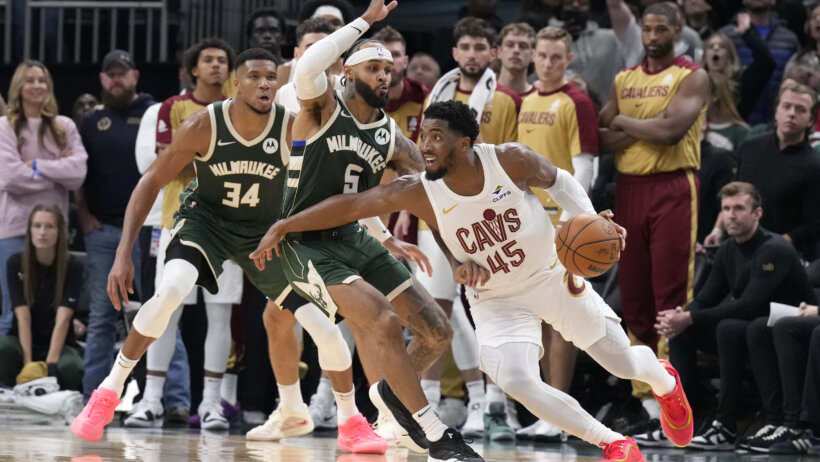 Cleveland Cavaliers guard Donovan Mitchell driving around a defender