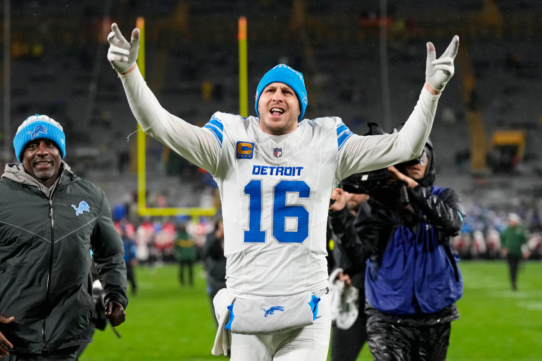 Detroit Lions quarterback Jared Goff celebrates as he runs off the field