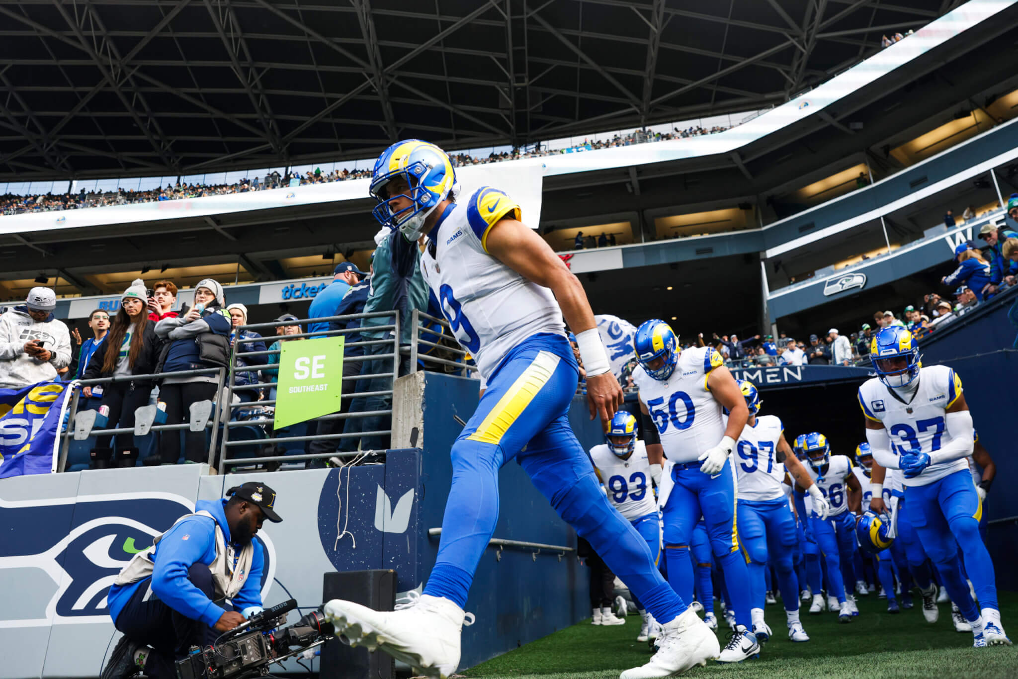 Matthew Stafford leads the Rams onto the field.