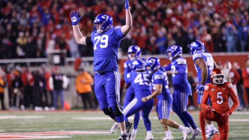 Brigham Young Cougars offensive lineman Kaden Chidester celebrates a win over Utah