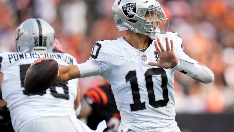 Las Vegas Raiders quarterback Desmond Ridder throwing a pass