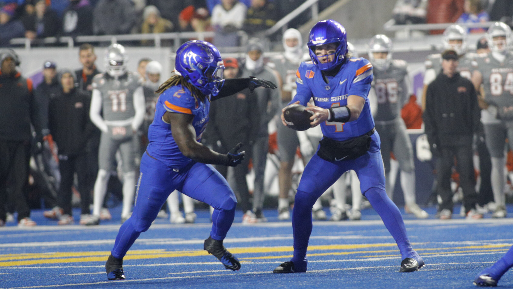 Boise State Broncos quarterback Maddux Madsen hands off to running back Ashton Jeanty