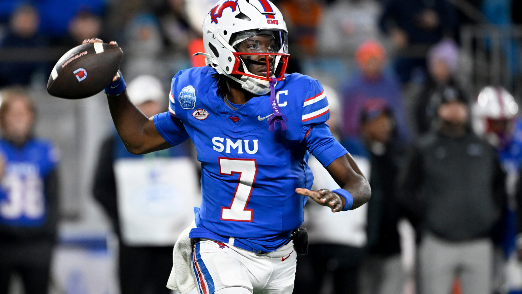 SMU quarterback Kevin Jennings looks to throw