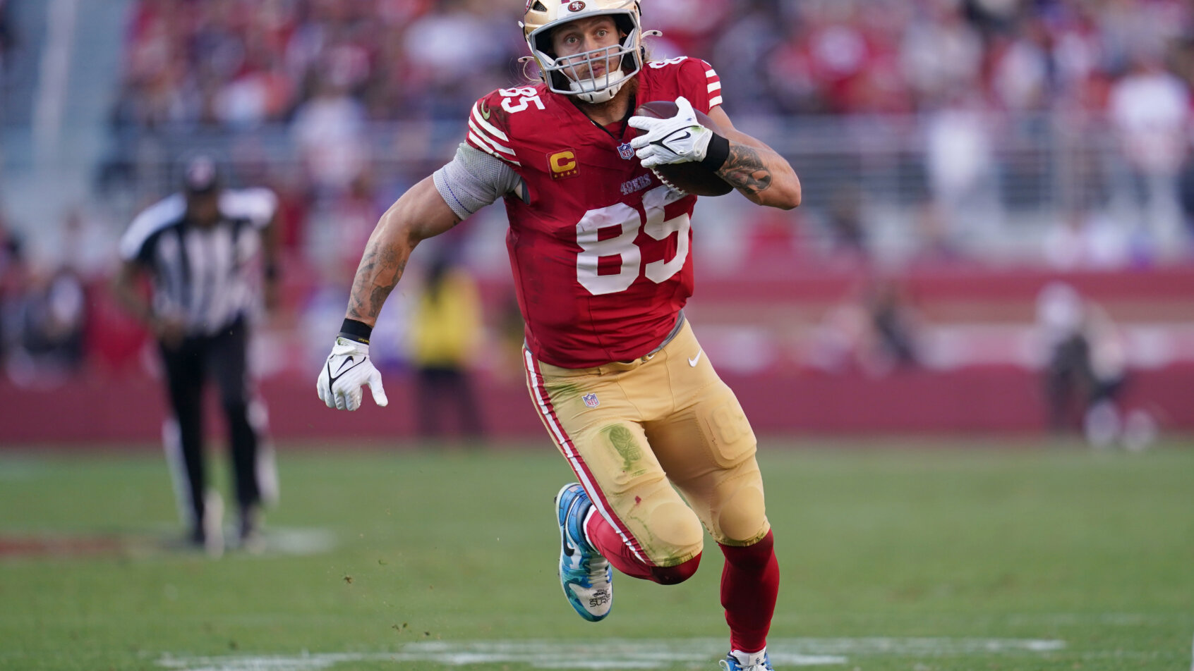 San Francisco 49ers tight end George Kittle running with the ball