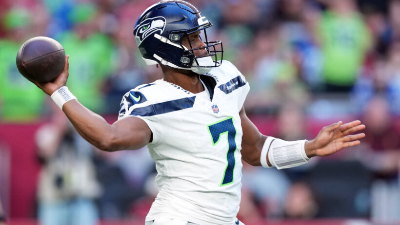Seattle Seahawks quarterback Geno Smith throwing a pass