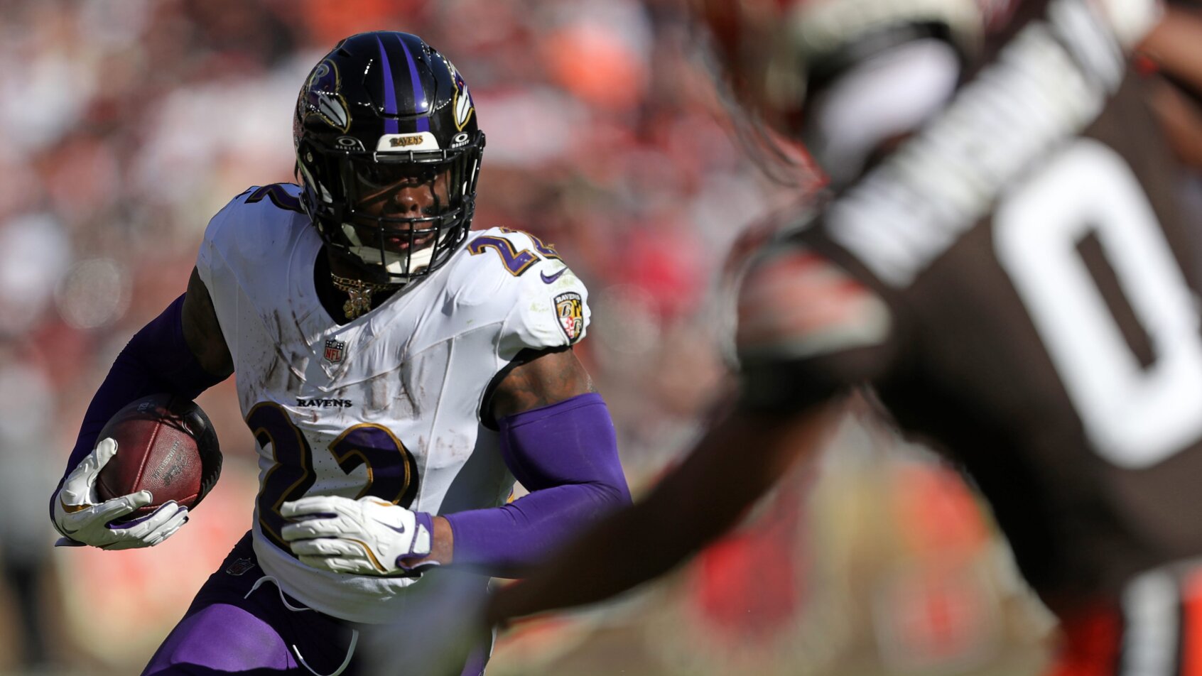 Baltimore Ravens running back Derrick Henry carrying the ball against the Cleveland Browns