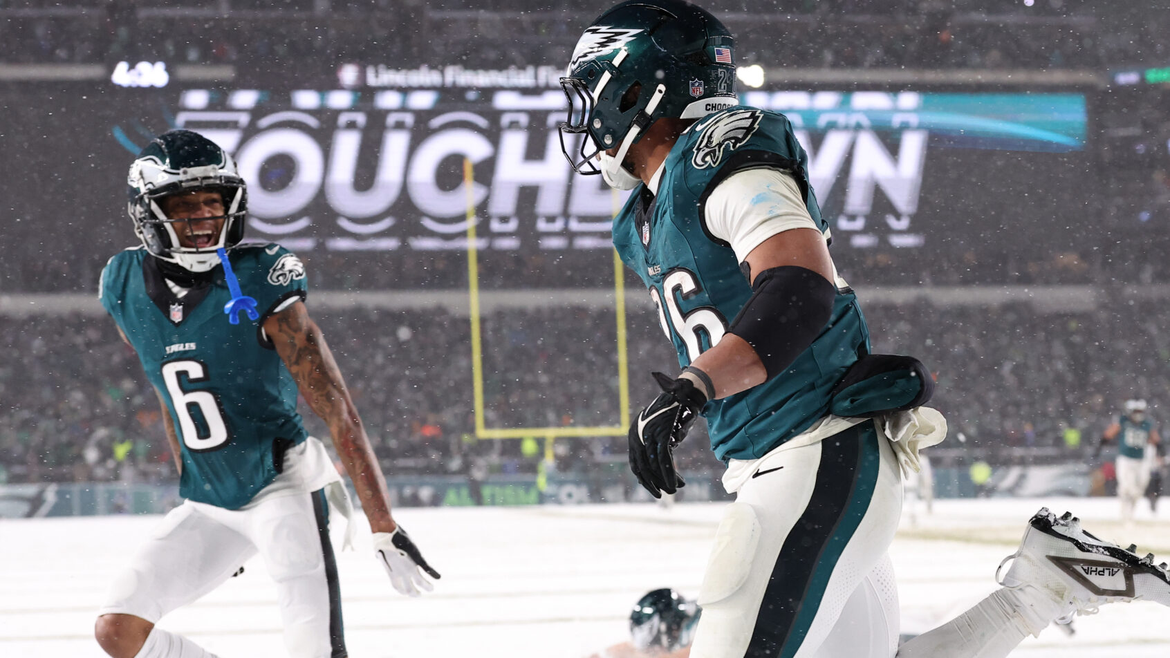 Philadelphia Eagles running back Saquon Barkley celebrates a TD with wide receiver DeVonta Smith