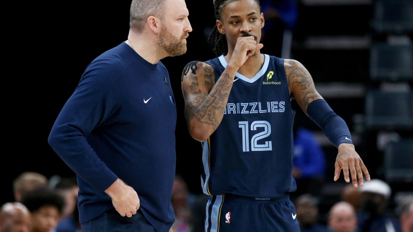 Grizzlies head coach Taylor Jenkins talks with guard Ja Morant during the fourth quarter