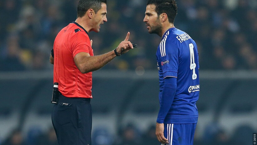 Fabregas arguing with the referee