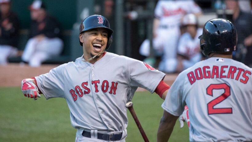 Mookie Betts celebrates at home plate.