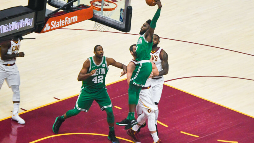 Jaylen Brown of the Celtics dunking against the Cavaliers