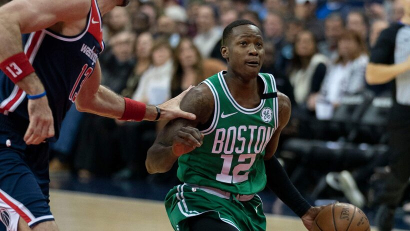 Boston Celtics guard Terry Rozier drives to the hoop against Washington.