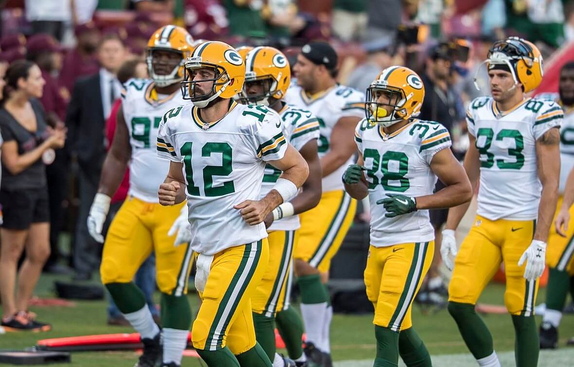 Aaron Rodgers taking the field.