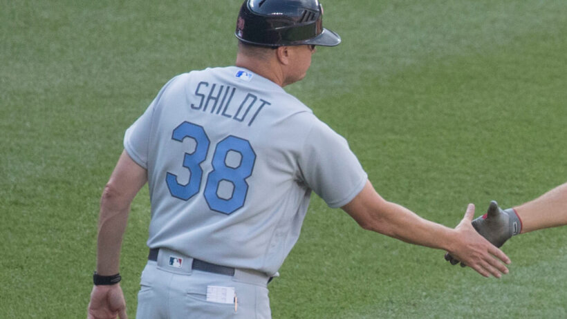 Mike Schildt of the Cardinals congratulating his player