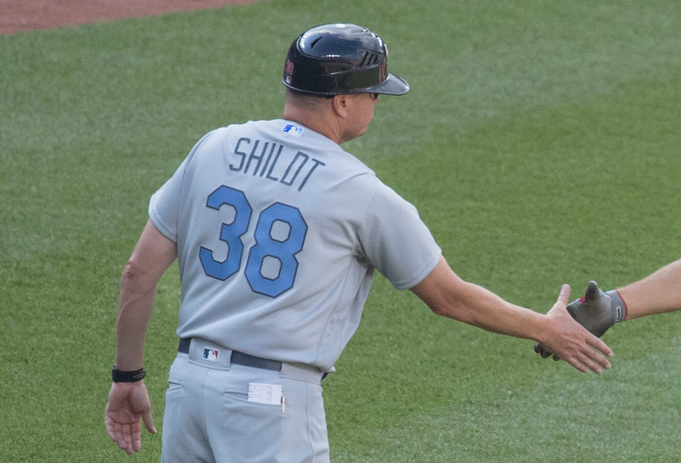 Mike Schildt of the Cardinals congratulating his player