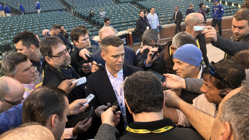 Theo Epstein talks to reporters at Wrigley Field.