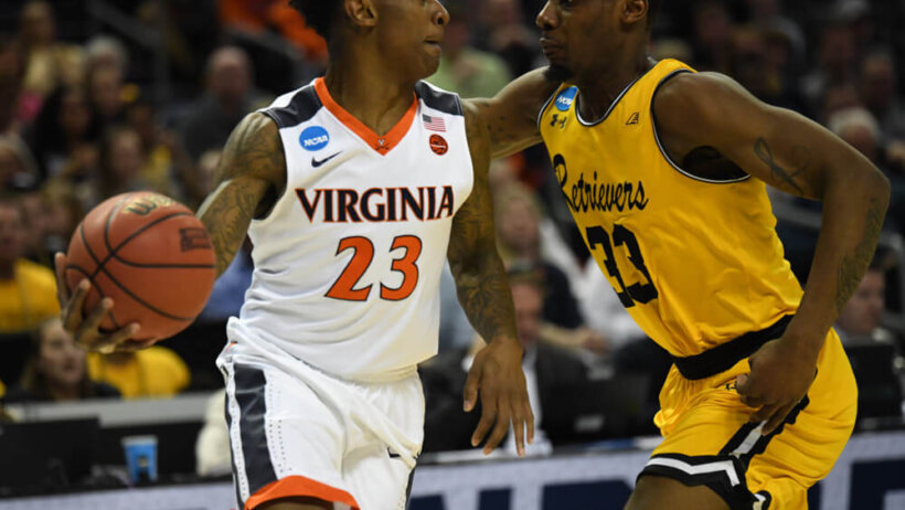 UMBC's Arkel Lamar guards Virginia's Nigel Johnson
