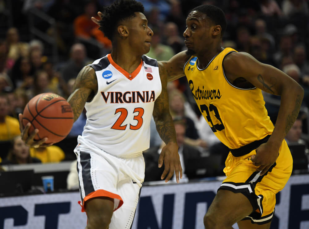 UMBC's Arkel Lamar guards Virginia's Nigel Johnson