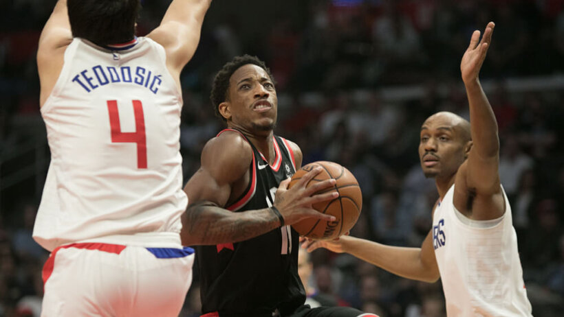 DeMar DeRozan driving to the basket.