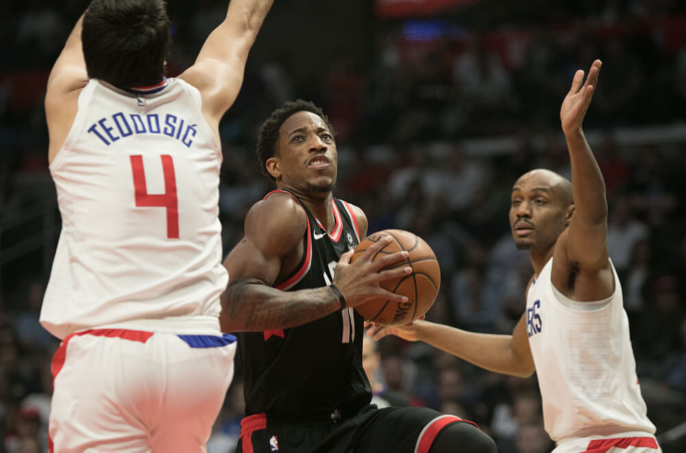 DeMar DeRozan driving to the basket.