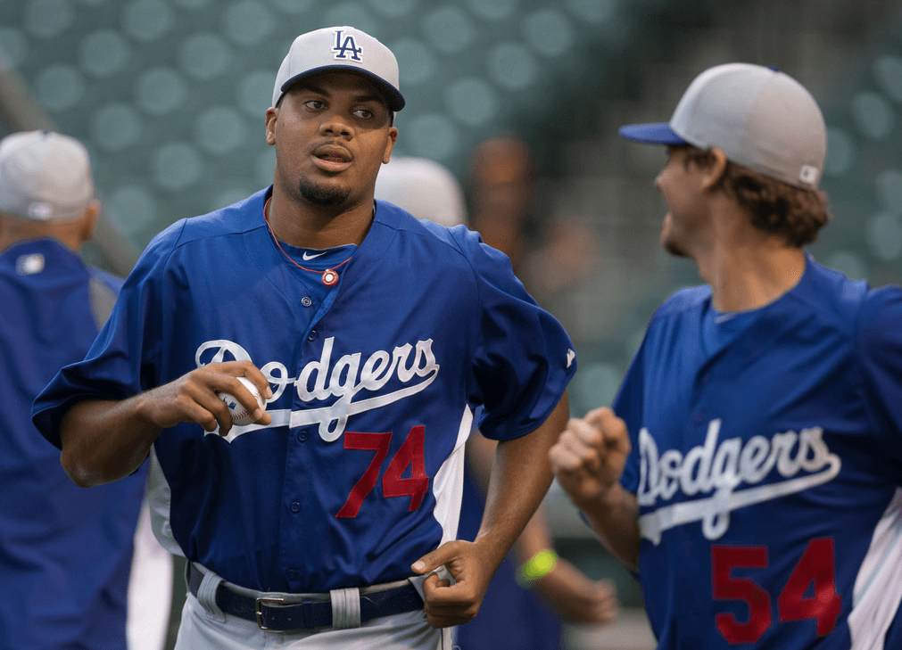 Dodgers pitchers Kenley Jansen and Clayton Kershaw jogging.